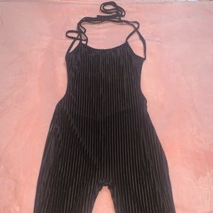 Black shirt backless romper with strings to tie in the back